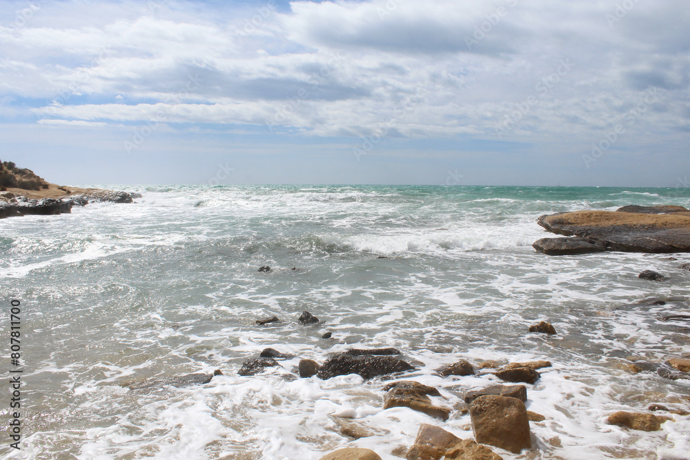 natural background of sea sky and stones, beautiful view of Mediterranean coast in Spain, waves in the sea natural background of sea sky and stones, beautiful view of Mediterranean coast in Spain, waves in the sea