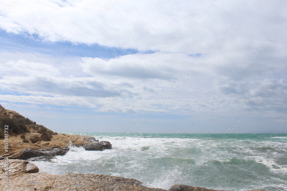 natural background of sea sky and stones, beautiful view of Mediterranean coast in Spain, waves in the sea natural background of sea sky and stones, beautiful view of Mediterranean coast in Spain, waves in the sea