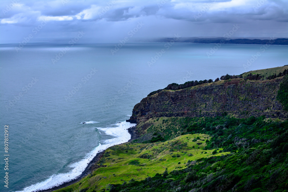 Panoramic view over Te Toto Gorge and Tasman Sea on an overcast summer day. High vantage point. Raglan, New Zealand