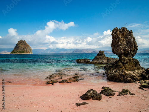 Discover the uniqueness of Pink Beach on Rinca Island, Labuan Bajo, where pink sands meet crystal-clear waters, creating a breathtaking spectacle of nature's beauty. photo