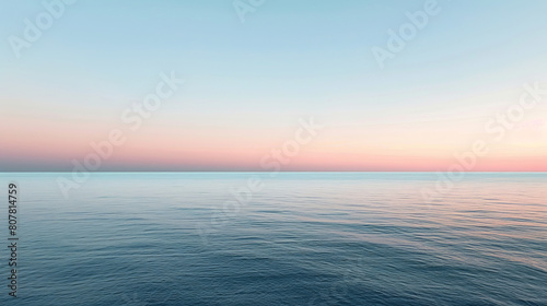 Serene ocean view at dusk with clear skies and soft hues photo