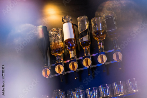 Cozy bar with beer taps and glasses on the wall