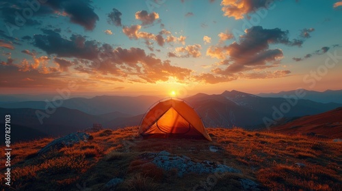 Sunset view with tent on mountain ridge