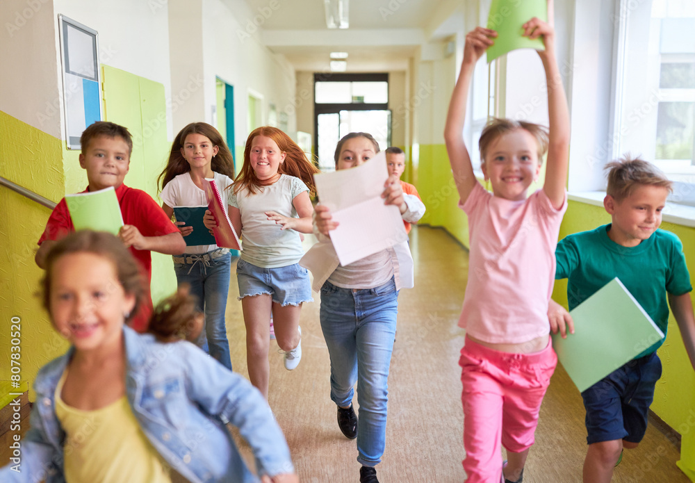Elementary students running in hallway at school Elementary students running in hallway at school