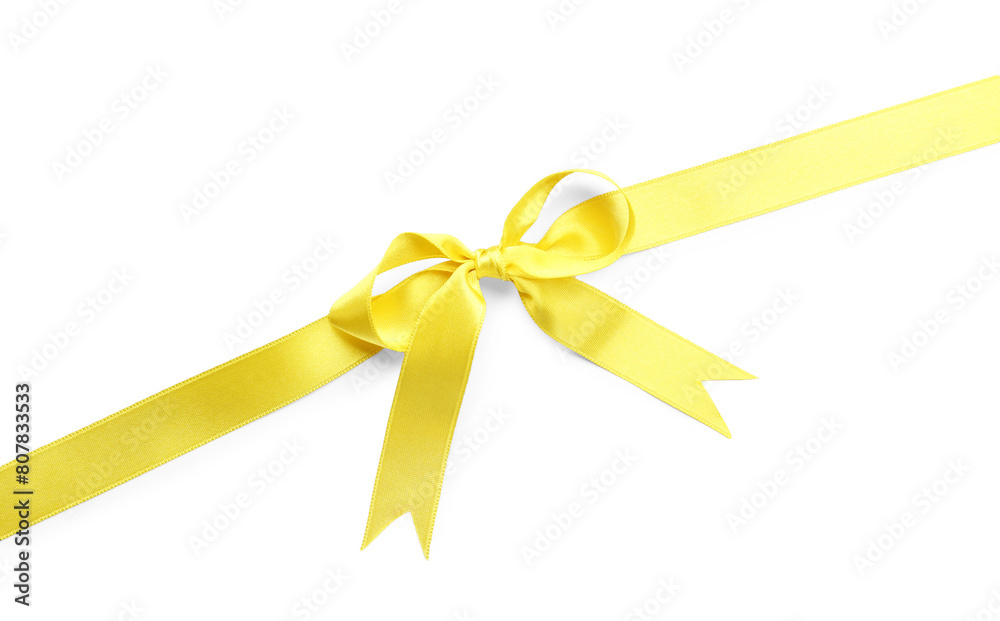 Yellow satin ribbon with bow on white background, top view Yellow satin ribbon with bow on white background, top view