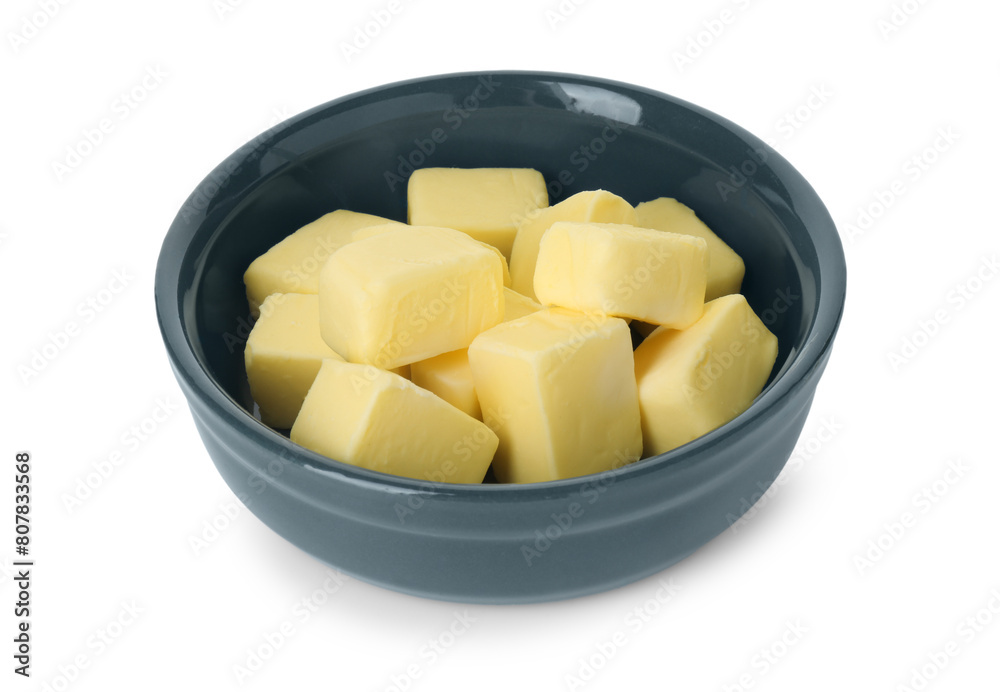 Tasty butter cubes in bowl isolated on white Tasty butter cubes in bowl isolated on white