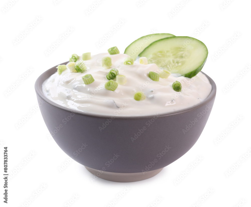 Delicious yogurt with green onion and cucumbers in bowl isolated on white