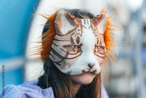 quadrobics. girl in a cat mask is lying