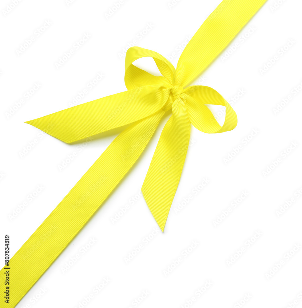 Yellow ribbon with bow on white background, top view Yellow ribbon with bow on white background, top view