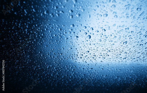 Raindrops on metallic surface texture backdrop © spacedrone808
