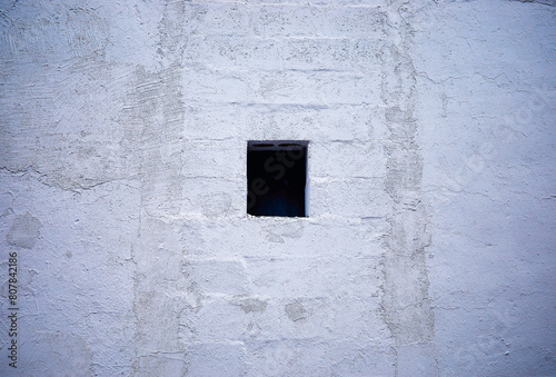 Small window in cement wall background © spacedrone808