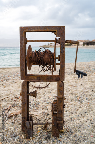 an old boat winch rusted by time and salt