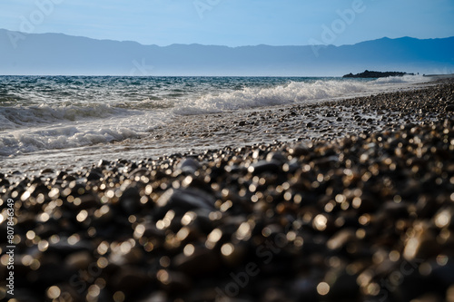 a pebble beach and clean sea in the Mediterranean