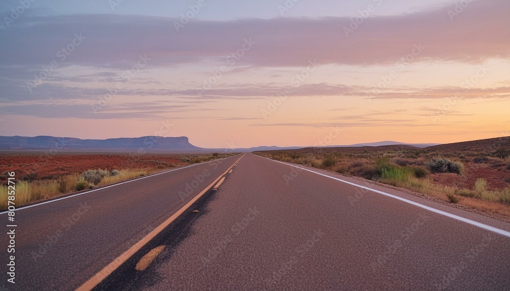american long quiet open road visible for miles first person view at sunset no traffic.