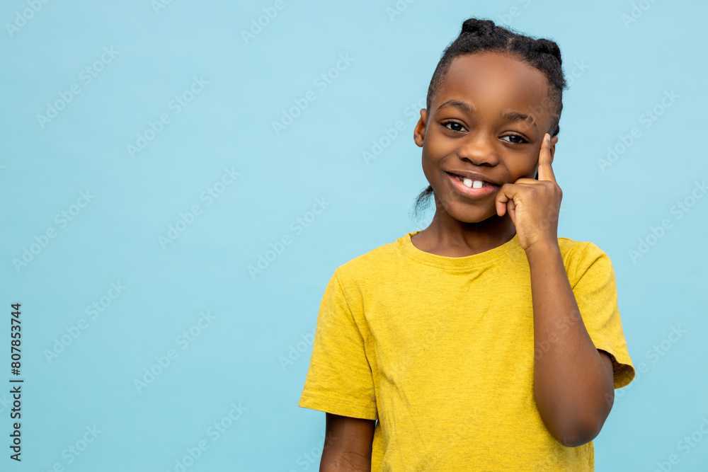 Cute dark-skinned boy looking excited and smiling nicely Cute dark-skinned boy looking excited and smiling nicely