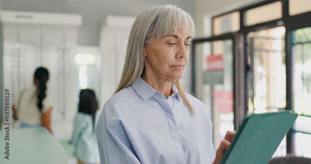 Optometrist, office and woman on tablet with results for patient, schedule and appointment at store. Mature doctor, optometry and specialist with information for advice, support and prescription Optometrist, office and woman on tablet with results for patient, schedule and appointment at store. Mature doctor, optometry and specialist with information for advice, support and prescription