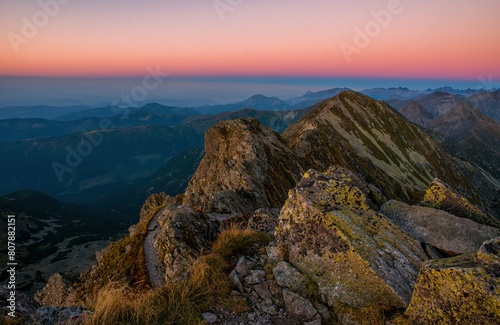 Beautiful colorful sunset on top of the hill. Hiking in Slovakia mountains Banikov and Ziarska valley, Western Tatras Slovakia. Beautiful mountain places of Europe photo