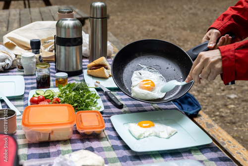 English breakfast with eggs on outdoor camping