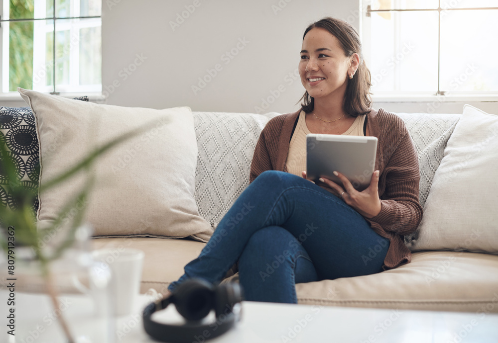 Woman, home and sofa with thinking on tablet for social media post and entertainment in living room. Female person, internet and streaming service or website for news update or online search Woman, home and sofa with thinking on tablet for social media post and entertainment in living room. Female person, internet and streaming service or website for news update or online search
