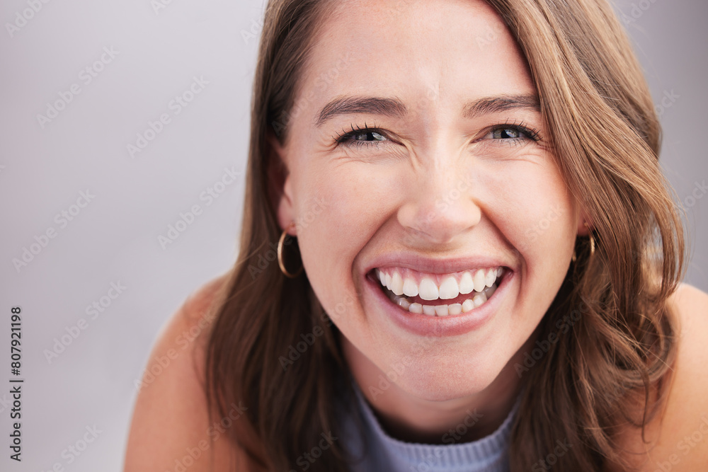 Laugh, beauty and portrait of woman in studio with positive, good and confident attitude. Happy, pride and headshot of person from Canada with smile for teeth health by gray background with mockup. Laugh, beauty and portrait of woman in studio with positive, good and confident attitude. Happy, pride and headshot of person from Canada with smile for teeth health by gray background with mockup.
