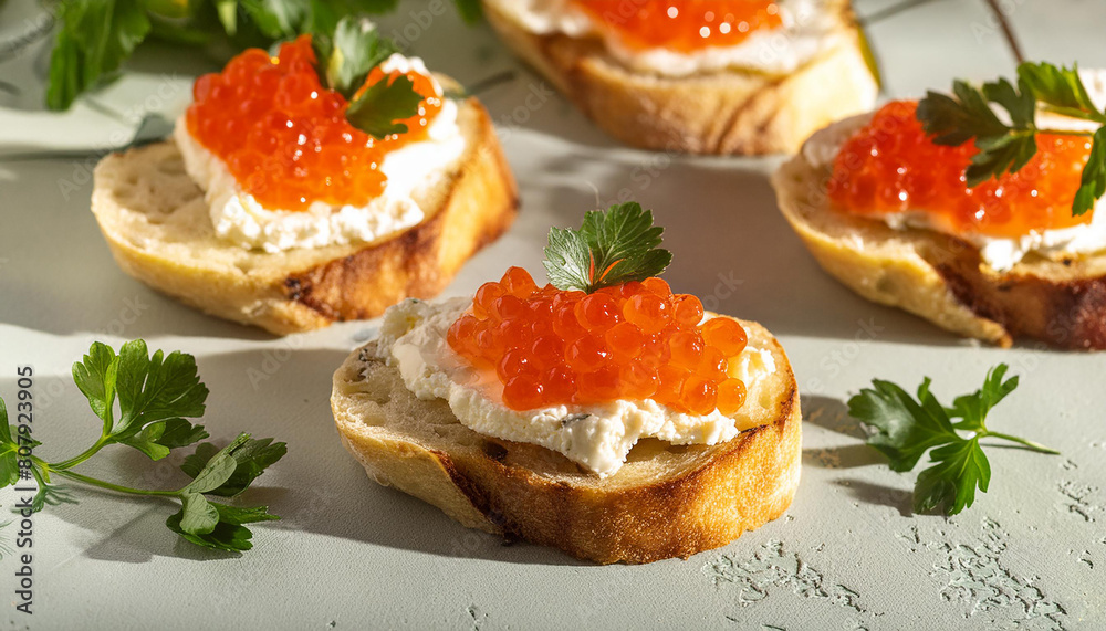 Bruschetta with cream cheese and red caviar. Delicious snack. Tasty delicacy. Culinary concept. Bruschetta with cream cheese and red caviar. Delicious snack. Tasty delicacy. Culinary concept.