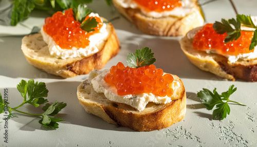 Bruschetta with cream cheese and red caviar. Delicious snack. Tasty delicacy. Culinary concept.