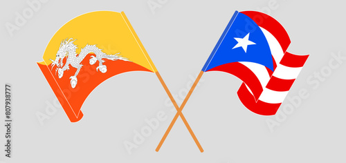Crossed and waving flags of Bhutan and Puerto Rico