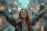Happy woman raised her hands up celebrating success, enjoys the rain outdoor