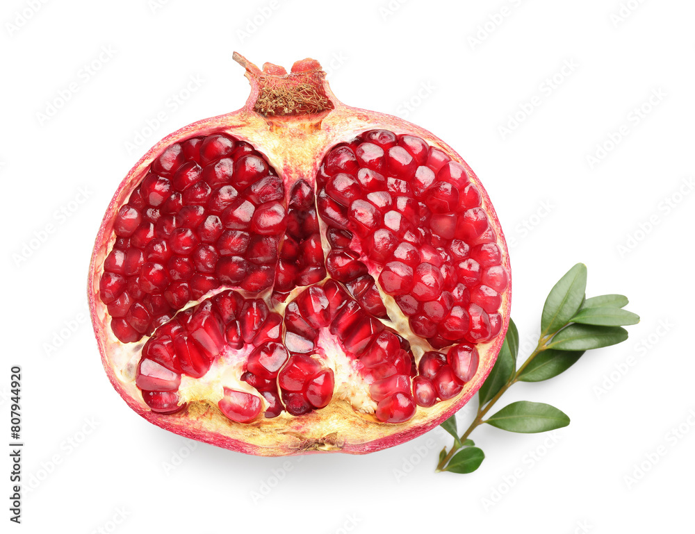 Half of fresh pomegranate and branch isolated on white, top view Half of fresh pomegranate and branch isolated on white, top view