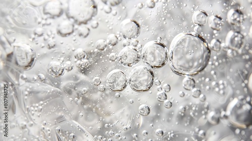 Crystal clear bubbles floating in clear liquid: a close-up view that captures the delicate and ethereal nature of water bubbles
