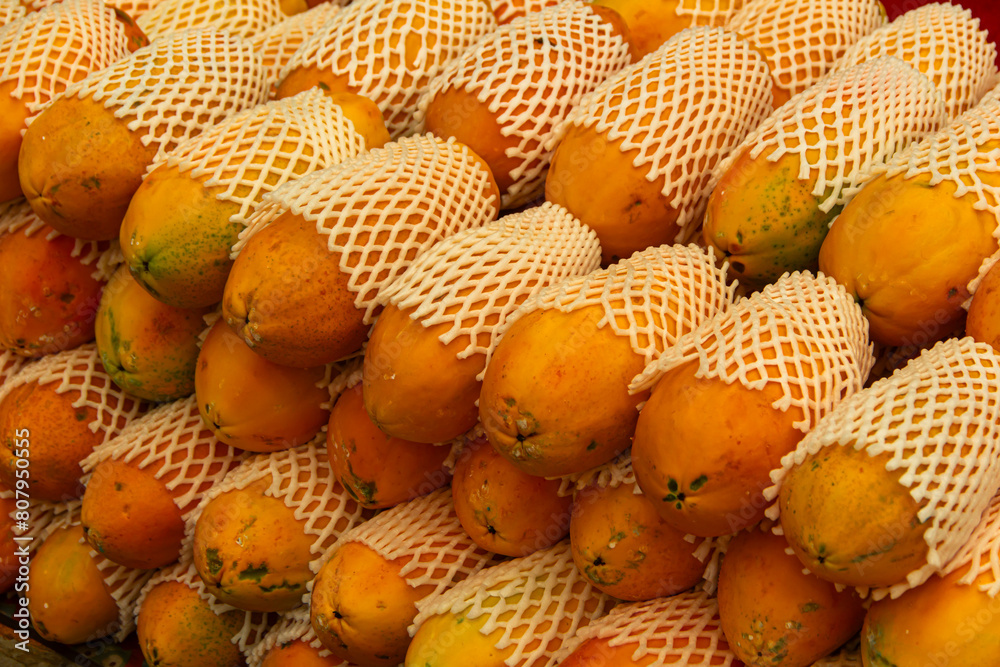 Group of yellow papayas for sale in maket Group of yellow papayas for sale in maket