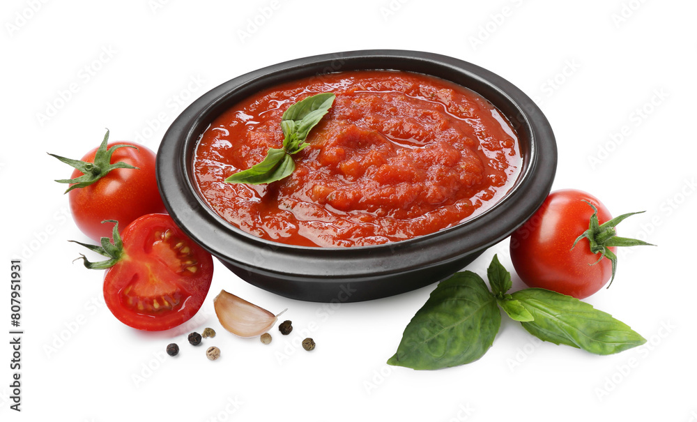 Homemade tomato sauce in bowl and fresh ingredients isolated on white Homemade tomato sauce in bowl and fresh ingredients isolated on white