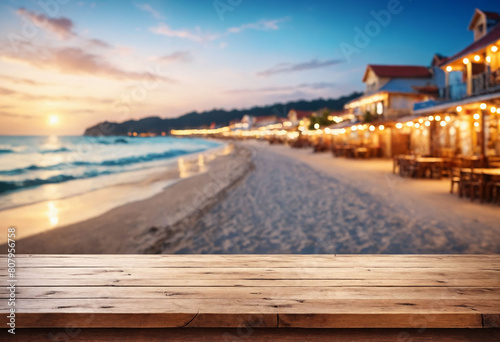 Wallpaper Mural Seaside Serenity, Wooden Table Overlooking Beach Cafes with a Dreamy Bokeh Lights Background Torontodigital.ca