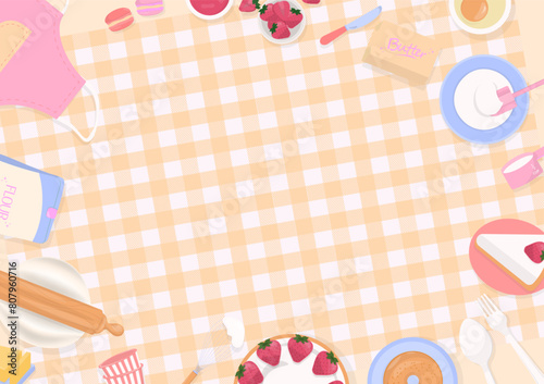 Cake and bakery ingredients on plaid tablecloth background
