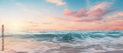 Tropical sunrise over the ocean with soft pastel colors providing a soothing background and a gradient sky for ample copy space.