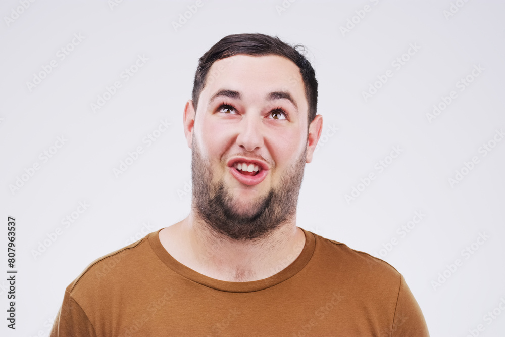 Man, funny face and open mouth in studio for comic, comedy and crazy or weird expression. Comedian, facial gesture and pout for joke, prank and laugh on isolated gray background with mockup space Man, funny face and open mouth in studio for comic, comedy and crazy or weird expression. Comedian, facial gesture and pout for joke, prank and laugh on isolated gray background with mockup space
