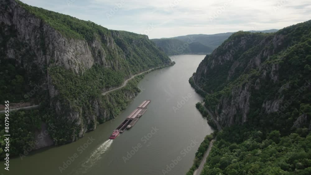 Aerial top view of Danube Gorge, Romania. Mountain landscape of a barge along the Danube shore Aerial top view of Danube Gorge, Romania. Mountain landscape of a barge along the Danube shore
