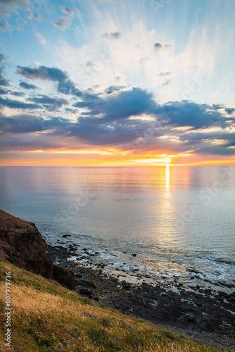 Dramatic sunset with fishing boat viewed from Hallett Cove Beach, South Australia © myphotobank.com.au
