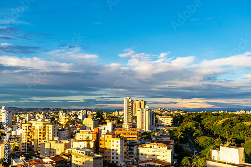 Residential buildings seen from above in the city of Belo Horizonte. Beautiful blue sky with clouds. Vehicle traffic. Horizontal.
