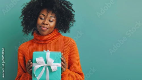 A Woman Admiring Her Gift photo