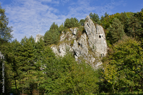 Autumn landscape. A rock in an autumn forest