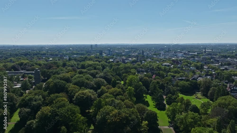 Aerial drone view of Bochum Park, also known as Stadtpark Bochum, featuring Fossilium Bochum Zoo. This spacious green space includes a boating pond and a zoo, offering a delightful blend of nature . Aerial drone view of Bochum Park, also known as Stadtpark Bochum, featuring Fossilium Bochum Zoo. This spacious green space includes a boating pond and a zoo, offering a delightful blend of nature .