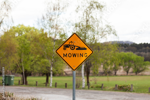 Mowing sign in permanent place in parkland photo