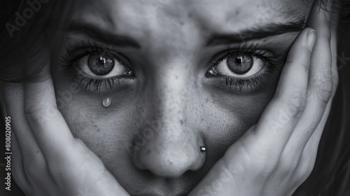 close-up of a woman's tearful eyes and folded hands, her expression conveying profound sadness and despair amidst life's difficulties, symbolizing the emotional struggle of depression and grief