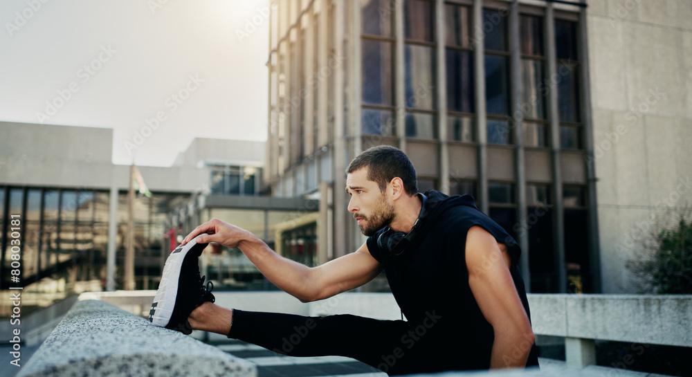 Stretching legs, fitness and man in city for warm up, cardio workout or endurance training. Outdoor, sports and athlete for parkour preparation, exercise challenge or thoughtful on rooftop building Stretching legs, fitness and man in city for warm up, cardio workout or endurance training. Outdoor, sports and athlete for parkour preparation, exercise challenge or thoughtful on rooftop building