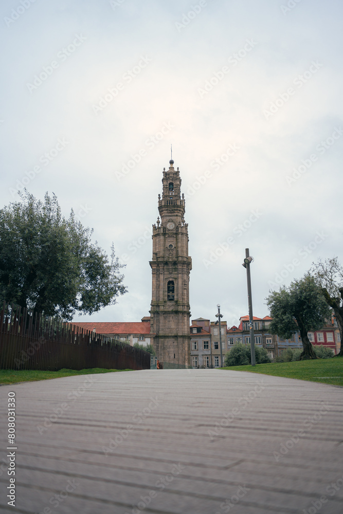 Tower dos clerigos against a grey sky in Porto, Portugal, showcasing baroque architecture