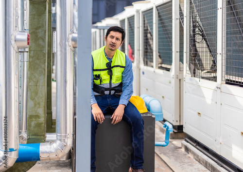 HVAC worker face fatigue, headaches, stress from long shifts and high expectations, impacting focus photo