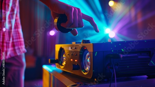 A dynamic image capturing the motion of a person adjusting focus and keystone correction on a portable projector for optimal image quality, with projections sharpening and dimensions aligning,