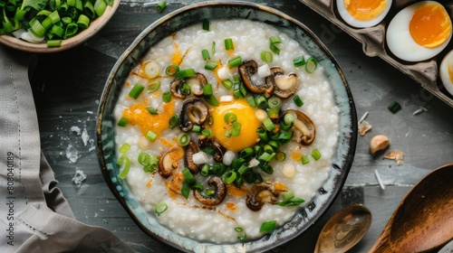 A traditional Chinese congee breakfast topped with century eggs and scallions