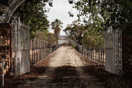 Old iron gates leading into a property photo